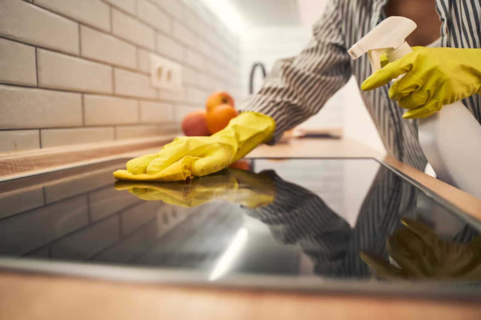 Cleaning a kitchen cooktop with attention to detail